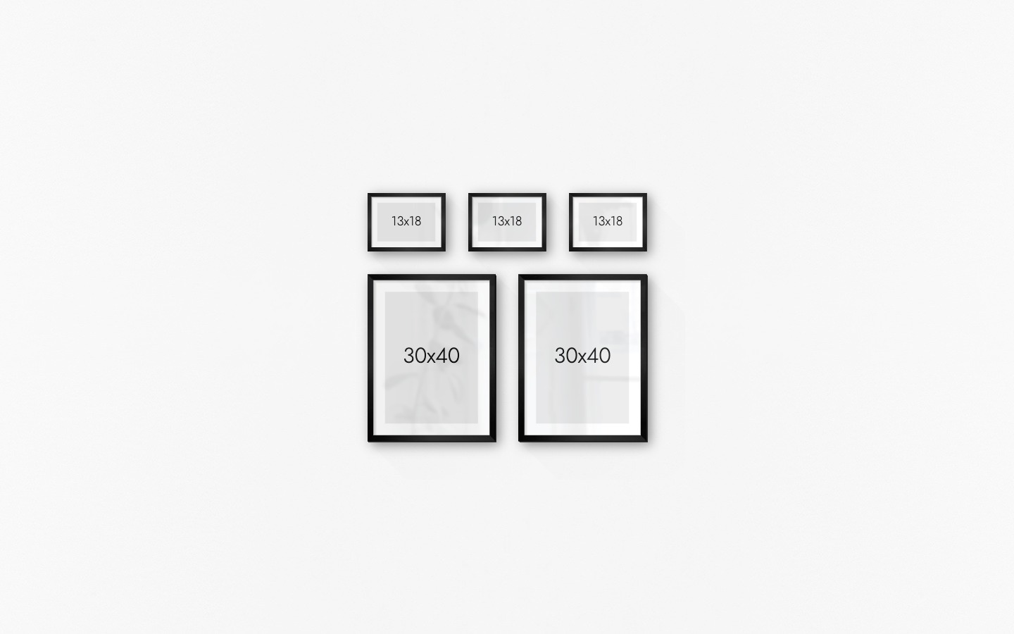 Gallery wall with picture frames in black in sizes 30x40 and 13x18