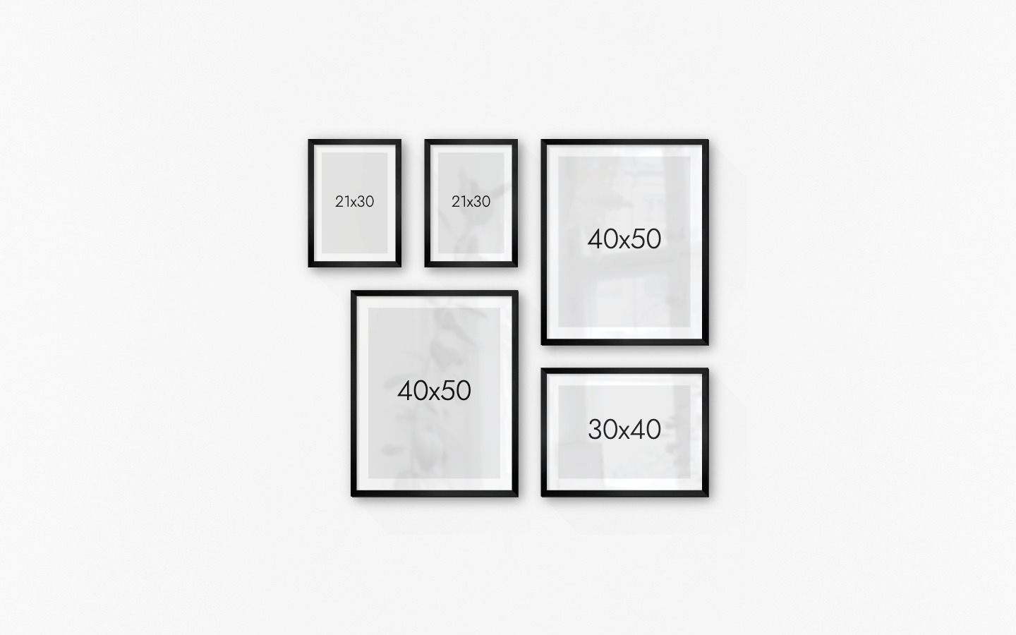 Gallery wall with picture frames in black in sizes 21x30, 40x50 and 30x40