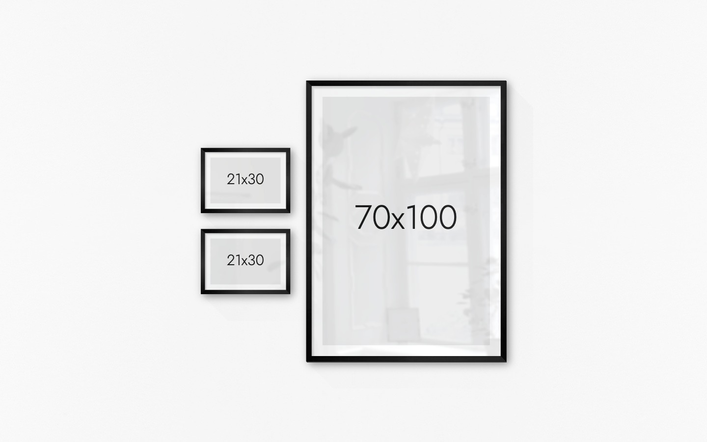 Gallery wall with picture frames in black in sizes 21x30 and 70x100