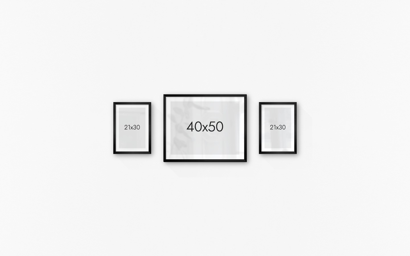 Gallery wall with picture frames in black in sizes 21x30 and 40x50