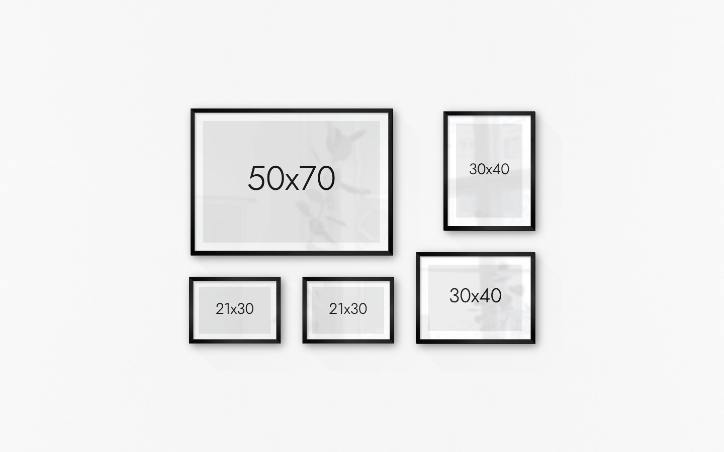 Gallery wall with picture frames in black in sizes 50x70, 21x30 and 30x40