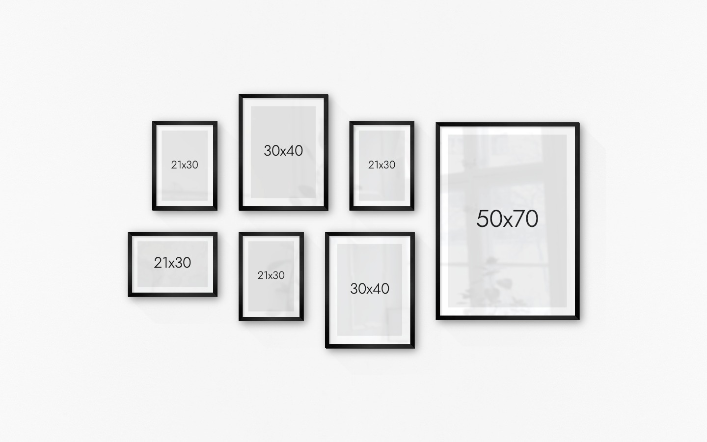 Gallery wall with picture frames in black in sizes 21x30, 30x40 and 50x70
