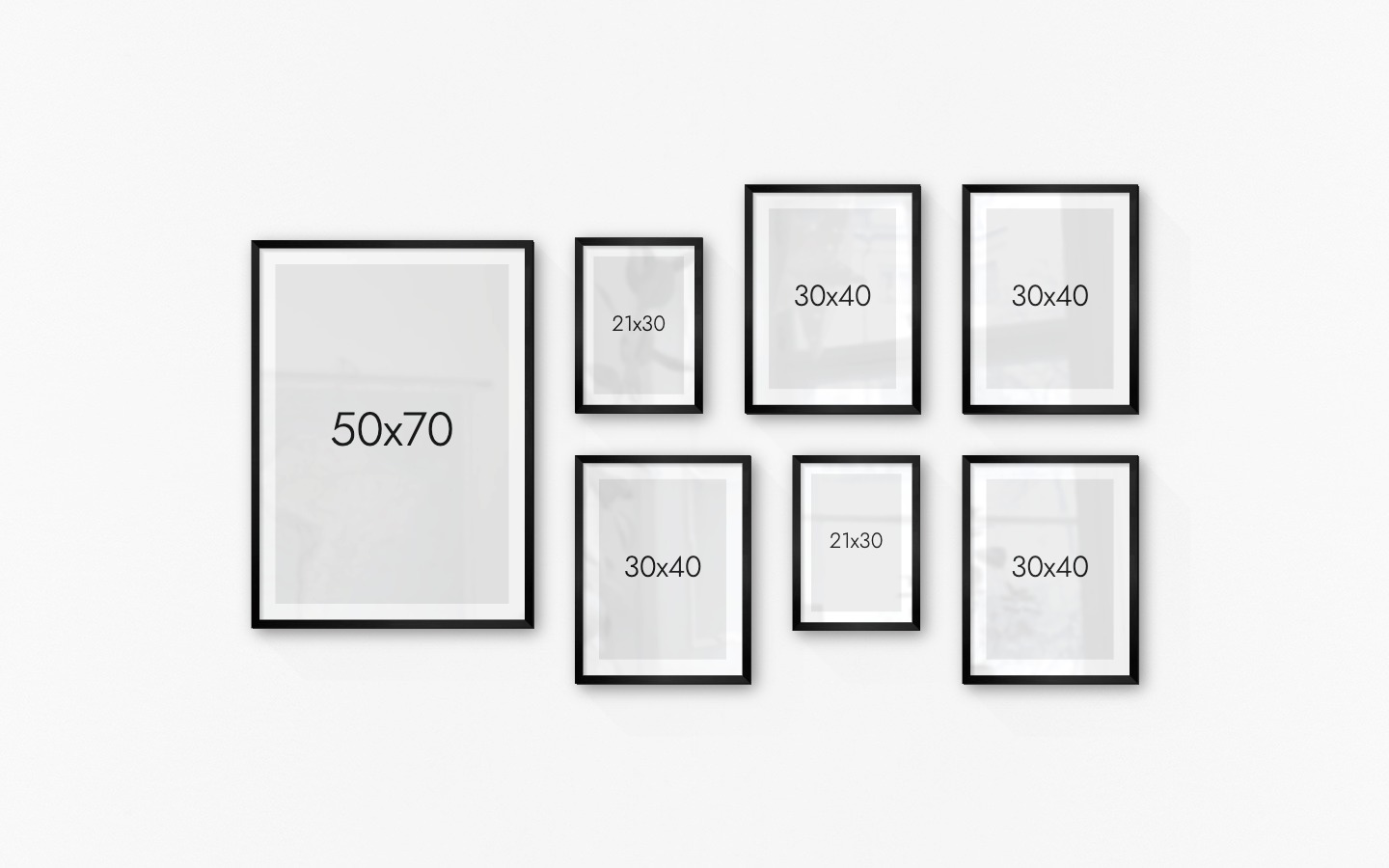 Gallery wall with picture frames in black in sizes 21x30, 30x40 and 50x70