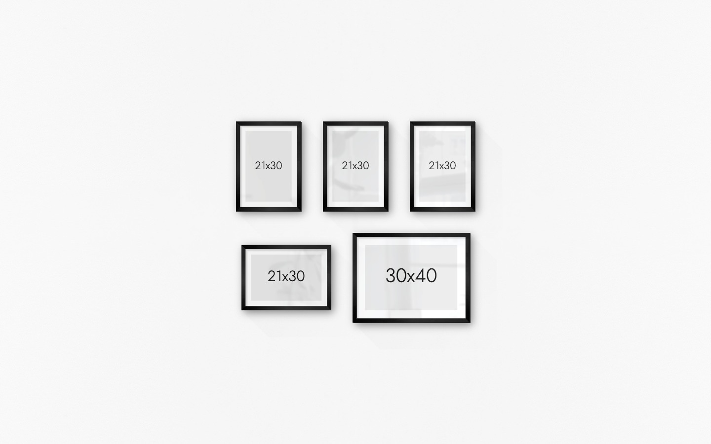 Gallery wall with picture frames in black in sizes 21x30 and 30x40